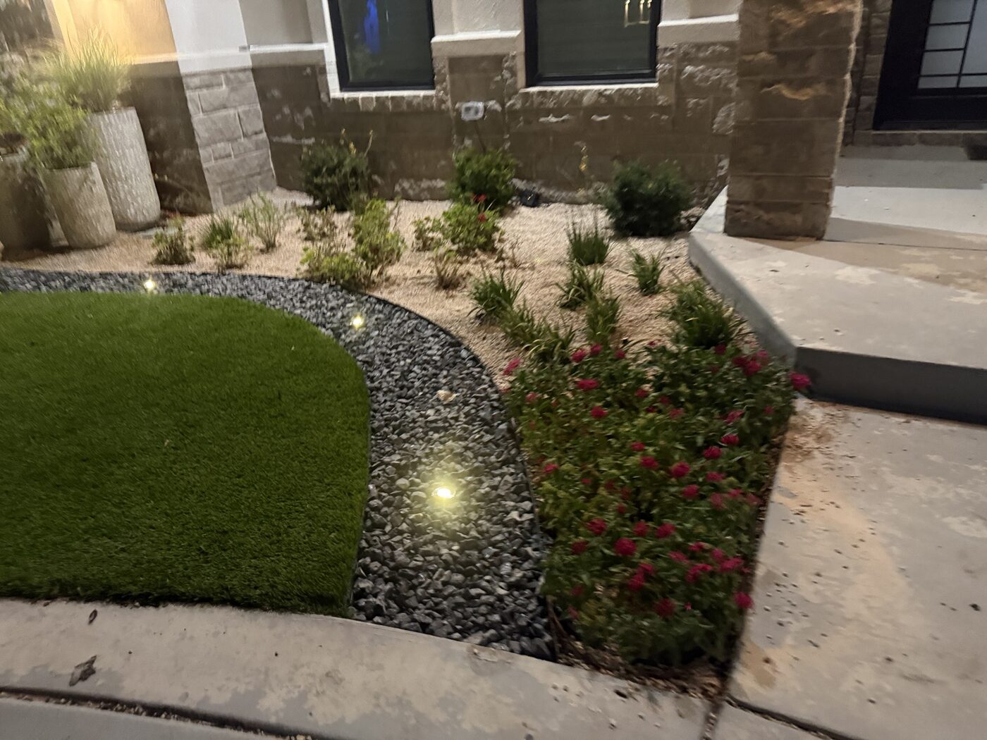 Finished landscaping with nighttime accent lighting